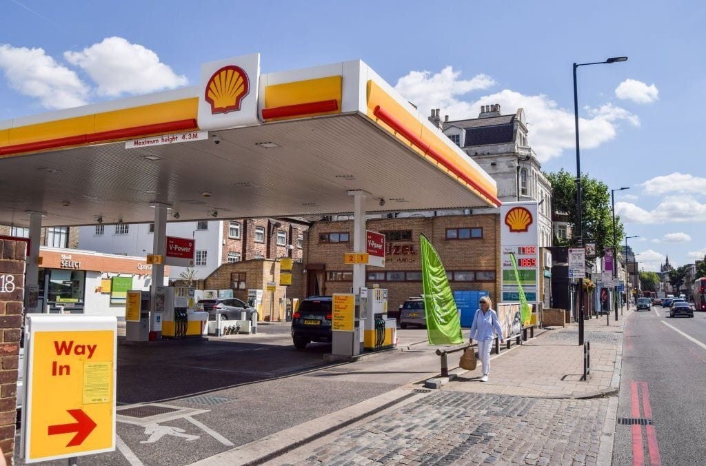 Shell petrol station located on a busy urban street, exemplifying sites that are becoming redundant due to the rise in electric vehicle use and the shift towards sustainable transportation. This image highlights the potential for redeveloping disused petrol stations into new housing developments, offering valuable land for residential use in prime locations.