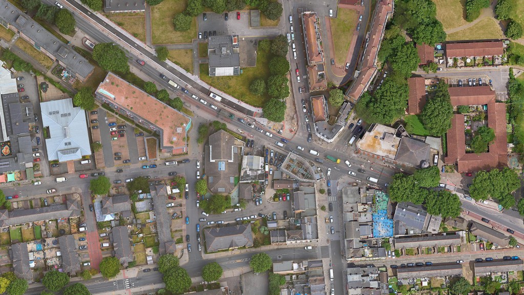 Aerial view of Evelyn Street, London, showcasing a mix of residential and commercial buildings. The image highlights the diverse architectural styles and the potential for redeveloping underutilised urban spaces into residential flats. Ideal site for urban regeneration and housing development projects.