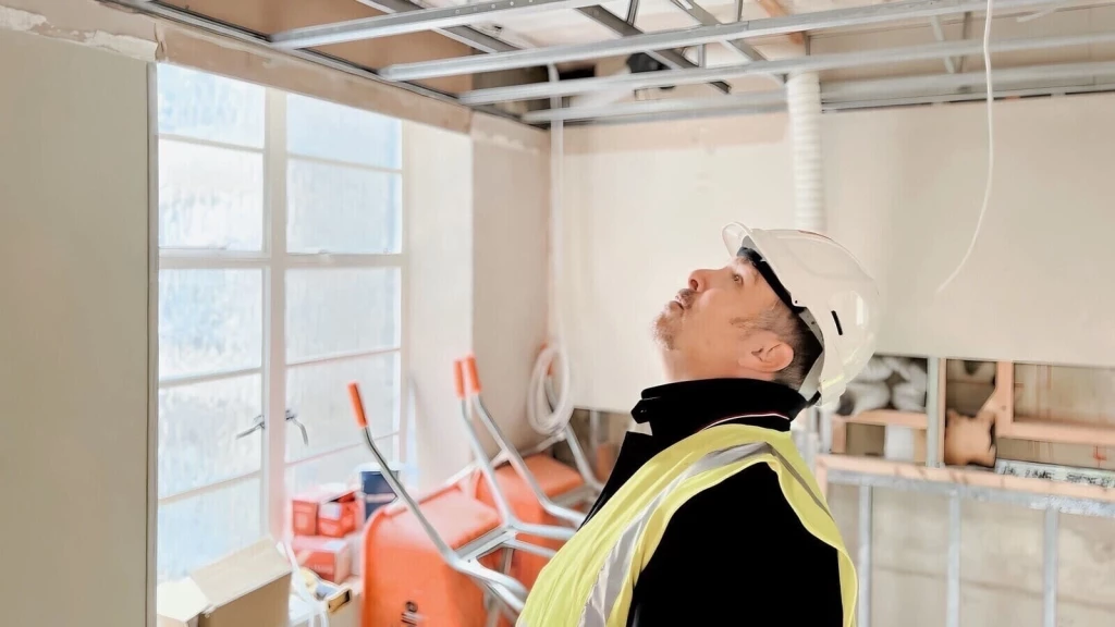 RIBA Chartered London Architect Robin Callister at a construction site.