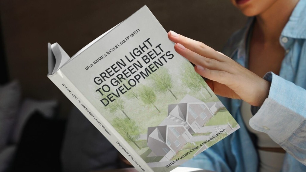 A person holding a book titled 'Green Light to Green Belt Developments,' exploring the integration of data centres within Green Belt areas.