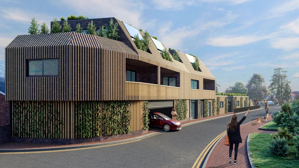 Street-level view of a modern small-site flatted development featuring sustainable architecture with vertical gardens, wooden cladding, and large windows, with pedestrians and a car leaving the gated ground floor parking garage.