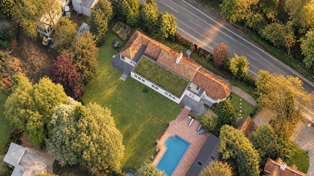 Aerial view of a Grade II listed dwelling in the Green Belt, showing a sensitively designed extension within the property’s large domestic curtilage.