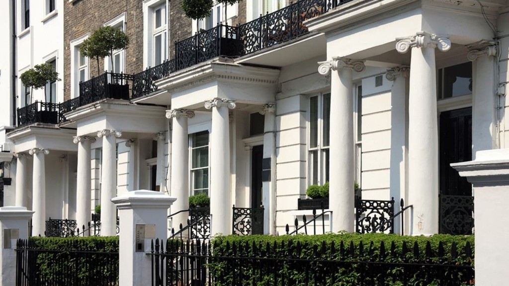 A row of classic Georgian townhouses with elegant columns and wrought-iron details, emphasising the potential for thoughtful Georgian house extensions.