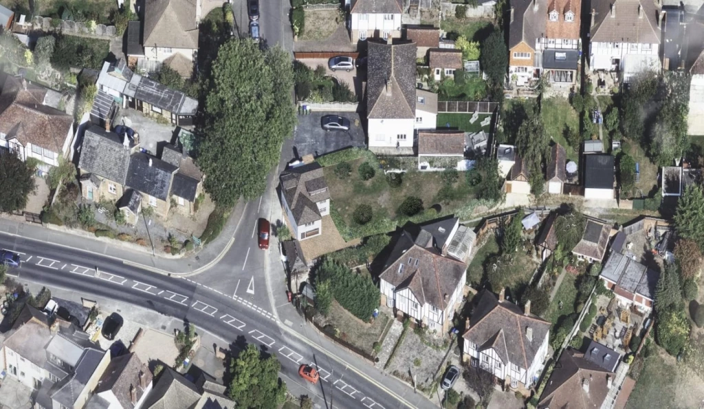Aerial satellite view of a detached property and its surrounding garden before a two-storey extension, showing the original 79 sqm footprint within a residential neighbourhood in London.
