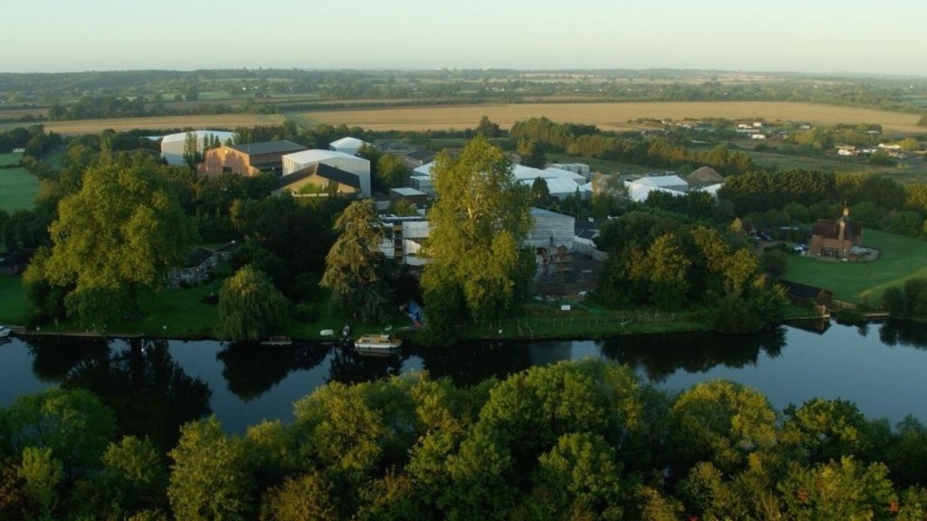 Aerial view of Bray Film Studios surrounded by lush greenery and a river, showcasing how film studios can integrate into the natural landscape.