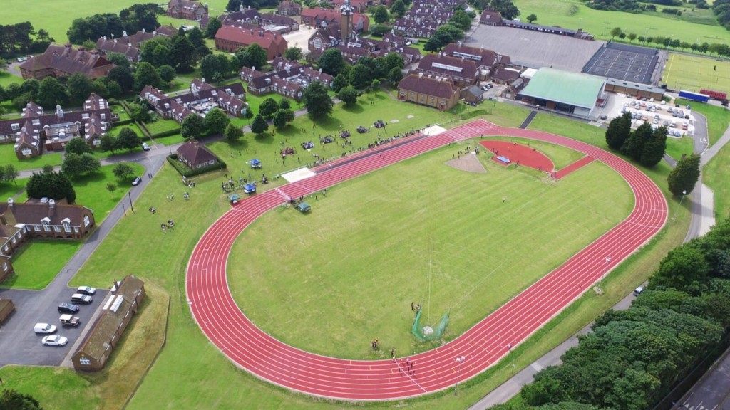 Aerial view of Focus School, Stoke Poges Campus, featuring new educational facilities and accommodation, illustrating integrated urban planning and recreational space in a suburban setting.
