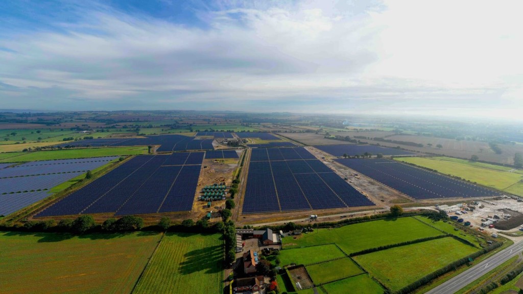 Sweeping aerial view of the an advanced DC-coupled solar farm, completed by Gridserve for Warrington Borough Council, providing secure and sustainable energy to support the country's transition to net zero.