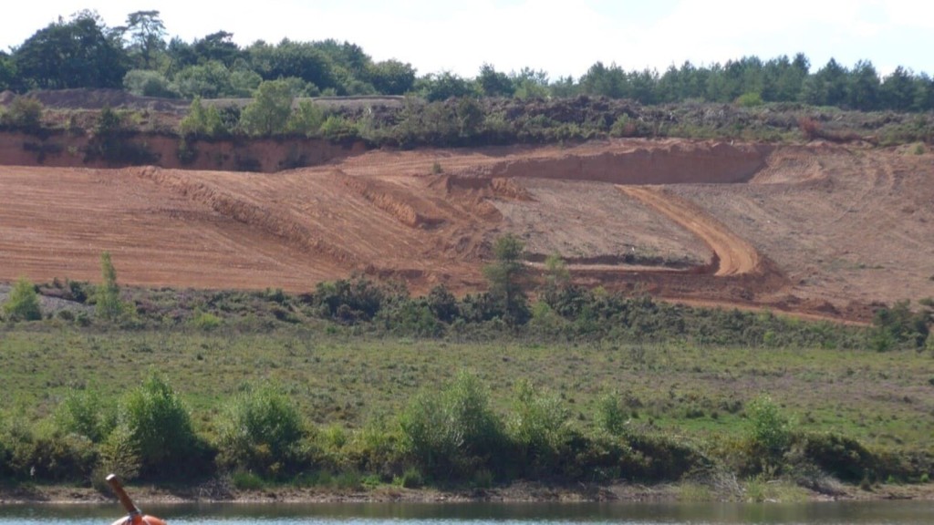 A section of cleared land within the Green Belt, illustrating the concept of grey belt. The image shows underutilised, low-quality land with minimal vegetation, representing areas targeted for housing development under Labour's grey belt plans. This initiative aims to address the UK's housing shortage by utilising land with limited environmental value.