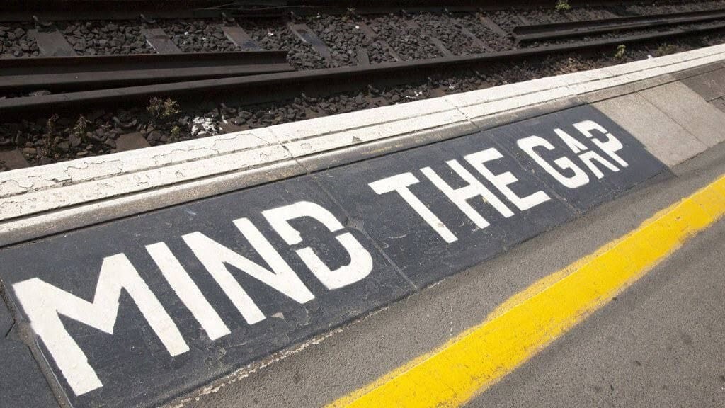 Photograph of a mind the gap markings on a London tube and/or railway platform 