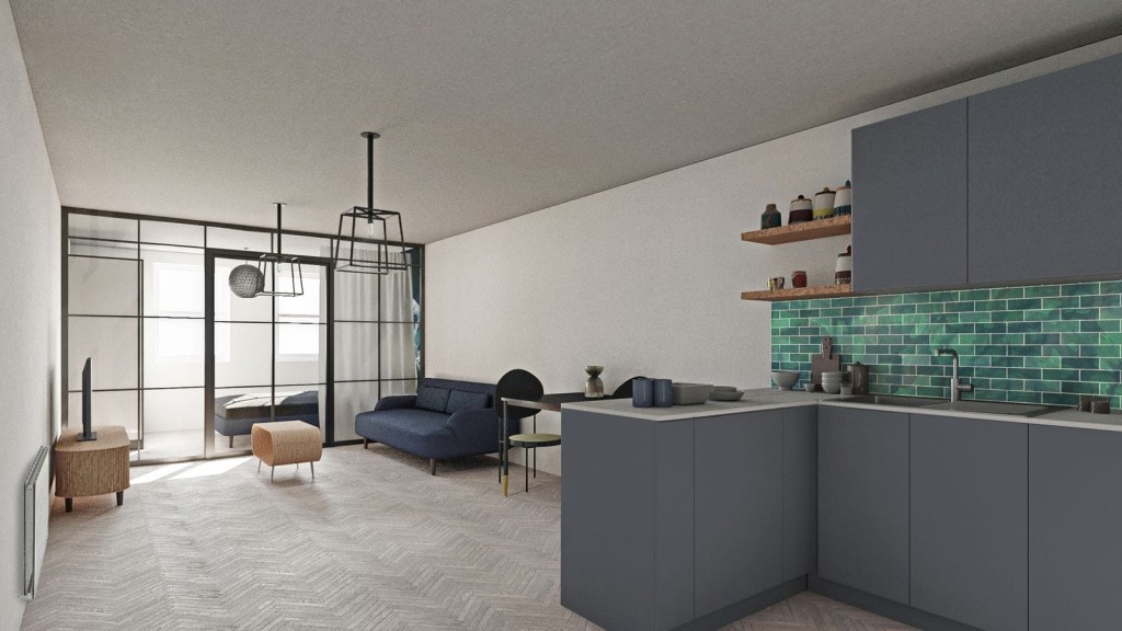 Modern open-plan loft apartment with herringbone flooring, featuring a sleek kitchen with dark grey cabinets and teal backsplash tiles, an industrial-style glass partition leading to the bedroom, and contemporary furniture including a navy blue sofa and round dining table.