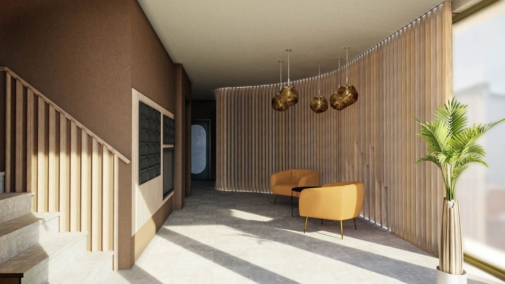 Modern office conversion interior showcasing a chic lobby with warm wood slat walls, sleek marble staircase, stylish golden pendant lighting, plush mustard armchairs, and a vibrant potted palm, embodying contemporary elegance in urban home design.