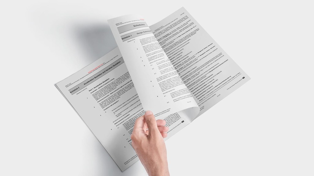 Person browsing through a JCT contract with detailed schedules, highlighting the complexities of construction contract management on a clean, white background.