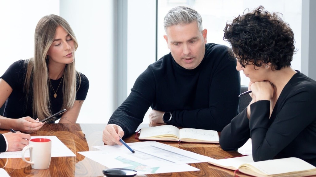 Architects closely reviewing site plans reflect the forward momentum one year on with Labour in charge, as the next phase of Grey Belt housing reforms takes shape.