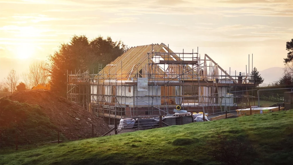 Self-build home under construction in the countryside, showing how planning permission turns land into a genuine development opportunity.