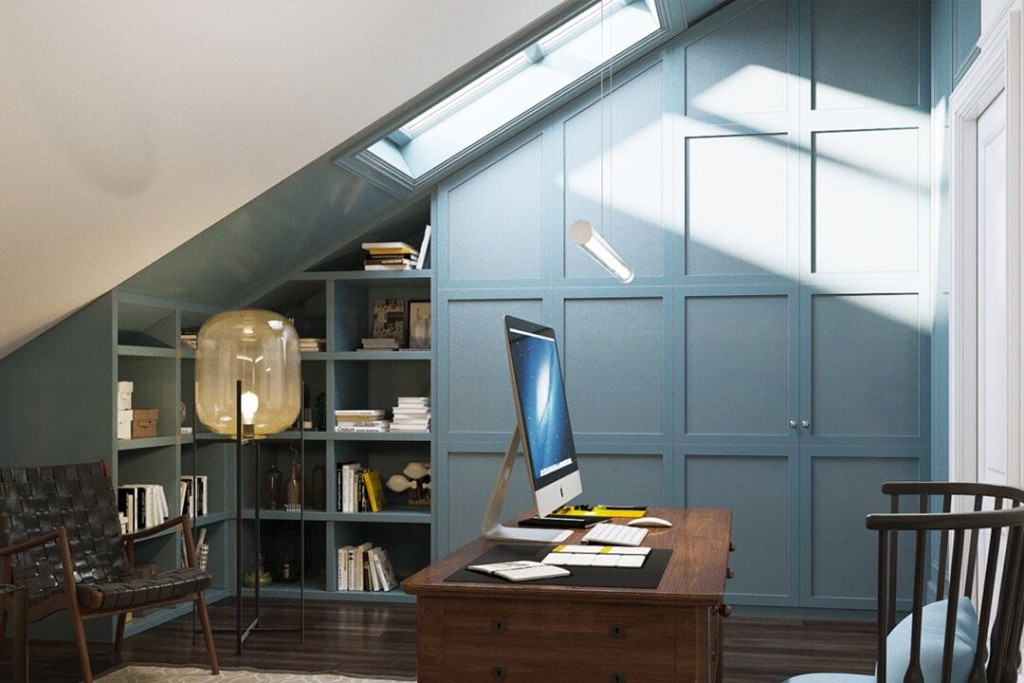 Dormer loft conversion with skylight velux window allowing a lot of natural sunlight to come into the home office space with baby blue integrated bookshelf and storage and matching dark brown woods from the floor, chairs and office desk