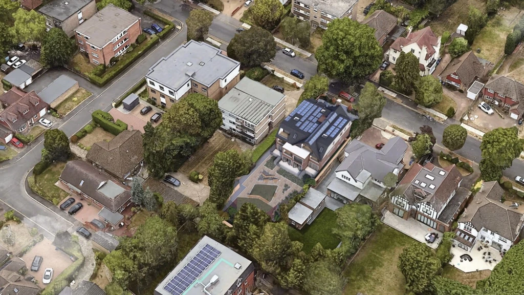A Google Earth-style aerial view of a suburban London residential block with an inserted CGI model of a redeveloped single dwelling converted into multiple flats.