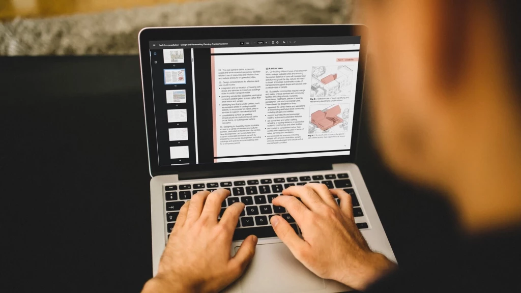 Person working on a laptop displaying UK planning policy guidance, reviewing land use and development design principles relevant to NPPF 2026 planning appeals.