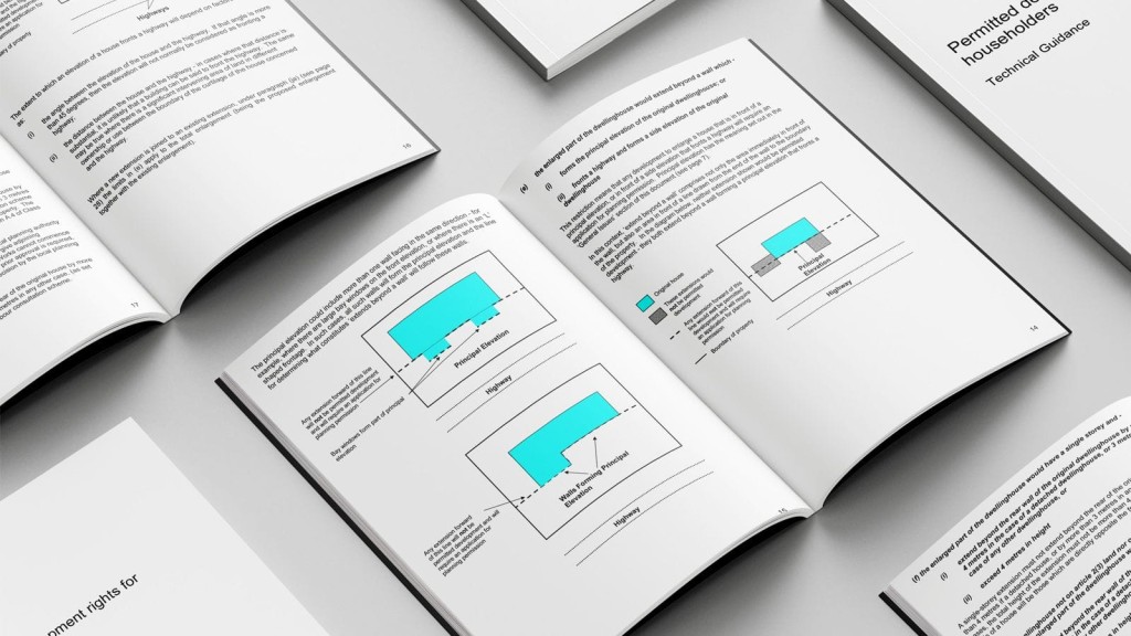 Several open booklets on a gray surface featuring detailed technical guidance for permitted development rights, with pages showing textual descriptions and schematic diagrams explaining various household extension rules, emphasising clarity and accessibility in planning documentation.