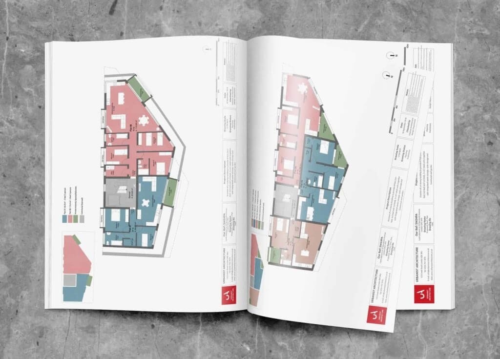 An architectural presentation booklet laid open on a concrete surface, showing colorful floor plans of a multi-unit building, complete with legends, labels, and design notes for reference.