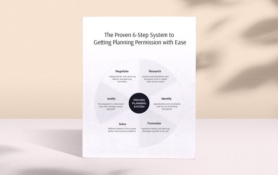 Planning Permission secrets, tips and strategies all laid out on a circle chart and split into six categories on a printed piece of paper resting on top of a white table and in front of a cream background