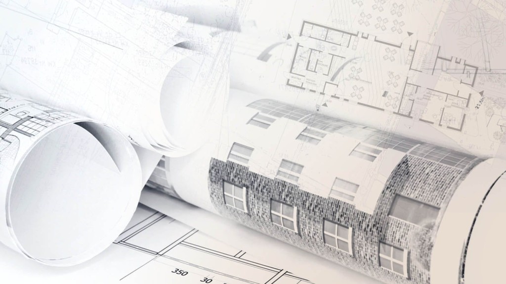 Rolled architectural blueprints featuring house extension plans with detailed facade and layout sketches on a white background.