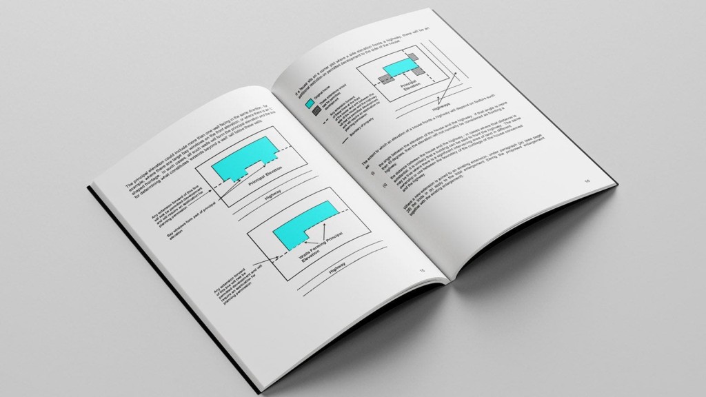 Open technical book displaying diagrams and text about architectural extensions, laid on a grey surface, illustrating detailed construction plans and elevation drawings.