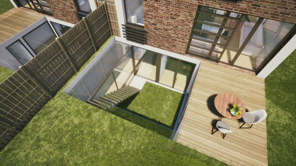 Aerial view of a modern urban backyard with a wooden deck, green lawn, outdoor furniture, and a glass-walled basement walkout, adjacent to a brick house facade.