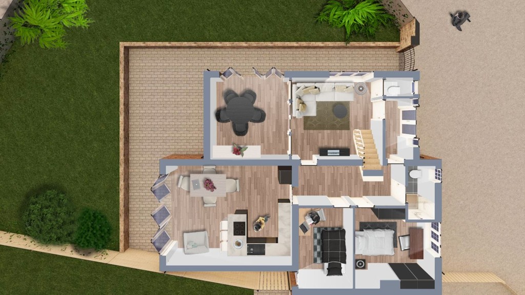 Top-down layout view of a proposed double-storey extension showing a furnished living area, kitchen, bedroom, and bathroom, with a landscaped garden and wooden fencing.