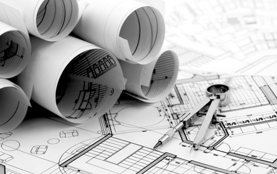 Monochrome image of rolled-up architectural blueprints with a compass and pen on top of a detailed building plan, highlighting concepts of architecture, design, and engineering.