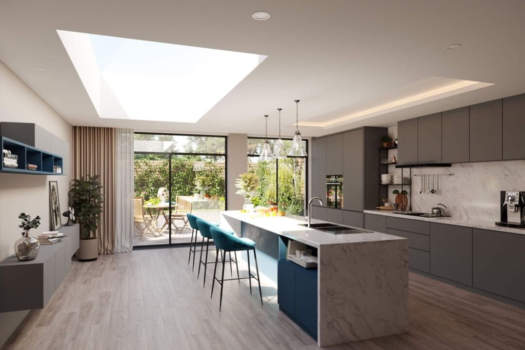 Rear kitchen extension ideas with a large retangular skylight shining onto the white marble kitchen island and three teal fabric bar stools leading directly onto a sunny and green garden with wooden patio furniture