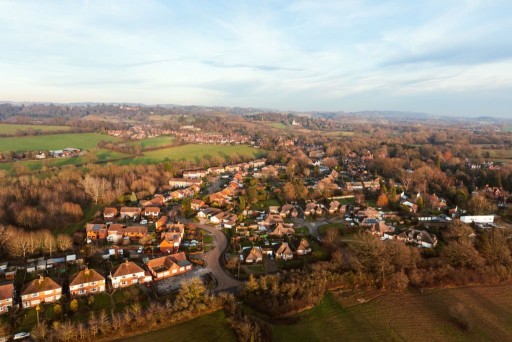 Aerial view of the 'Surrey style' architecture showcased in its neighbourhood alongside its very winding streets