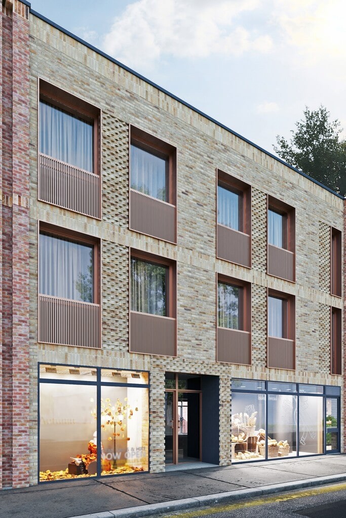 Architectural rendering for the proposal of a modern block of flats in South East London with the ground floor containing commercial units such as an art gallery or bakery and a separate flat entrance in the middle to acess the apartments that all have large pane windows and wooden slated juliette balconies