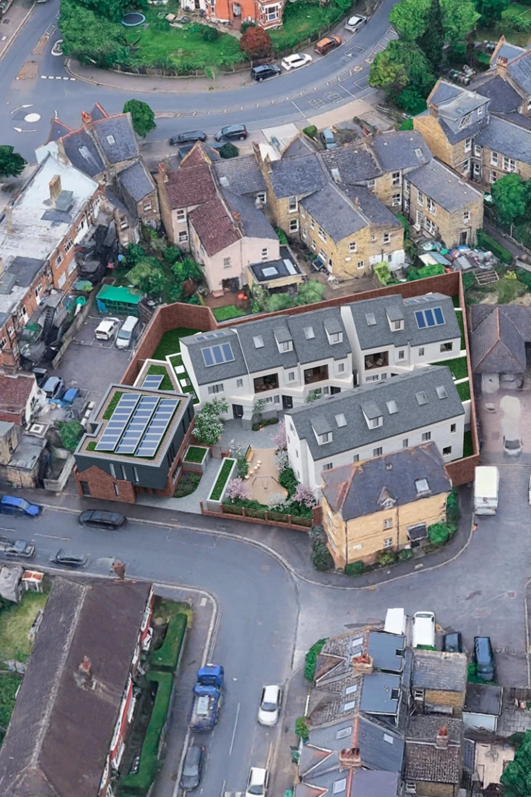 Aerial view of a residential redevelopment scheme in London granted planning permission, showing a courtyard-led layout of new-build dwellings, associated landscaping, boundary treatments and access arrangements, secured by Urbanist Architecture for an infill and backland residential development.