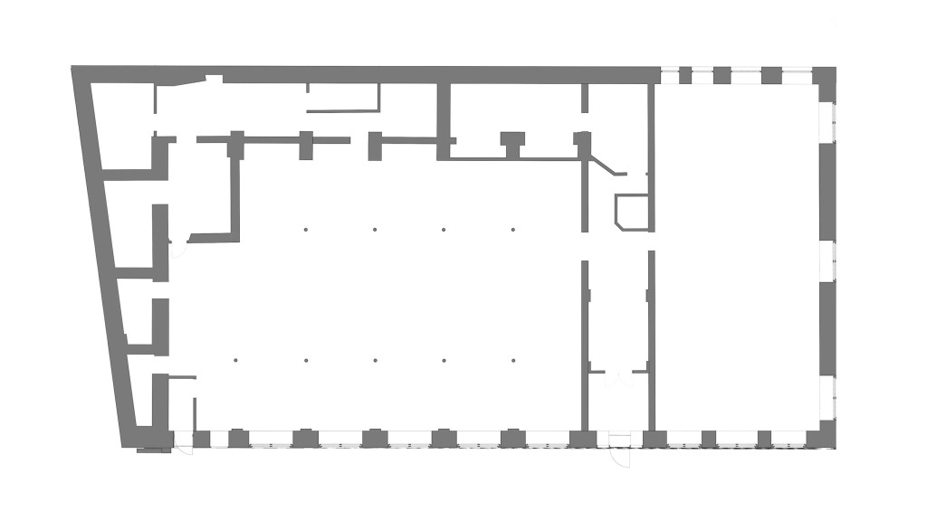 Existing ground floor plan of the 1910 Workmens Institute in Abertridwr, Wales, showcasing the layout before conversion into modern flats. This architectural floor plan highlights the original structure's spacious design, providing insight into the building's historical significance and potential for redevelopment.