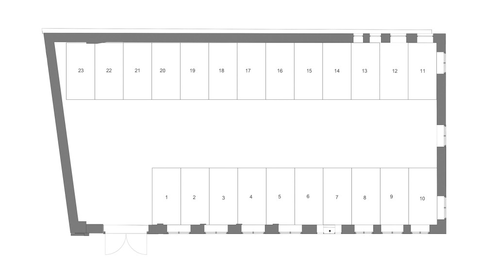 Proposed ground floor plan of the 1910 Workmens Institute conversion in Abertridwr, Wales, detailing the layout for modern flats. This architectural drawing illustrates the new design of the proposed ground floor to be a gated parking garage for the 24 contemporary residential units, blending the historical architecture with modern living and transport.