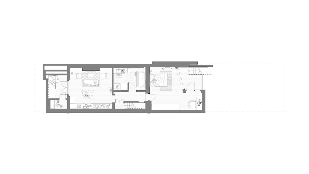 Proposed floor plan of the lower ground floor for a Victorian house on Queensbridge Road E8, designed by Urbanist Architecture. The design features a rear extension and rethought basement to enhance light and space utilisation. Key elements include a spacious kitchen and living area, a modern bathroom, and a bedroom with direct access to a larger, open lightwell. This plan integrates sustainable features such as photovoltaic panels and a ground-source heat pump, aiming to make the home ultra-sustainable while respecting its conservation area status. Ideal for modern, eco-conscious living in Hackney.