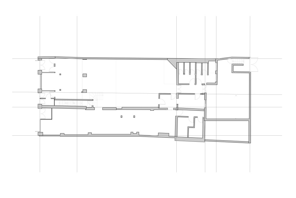 Architectural drawing of the existing ground floor plan for a mixed-use development in Greenwich, featuring detailed outlines of room layouts, door placements, and structural elements.