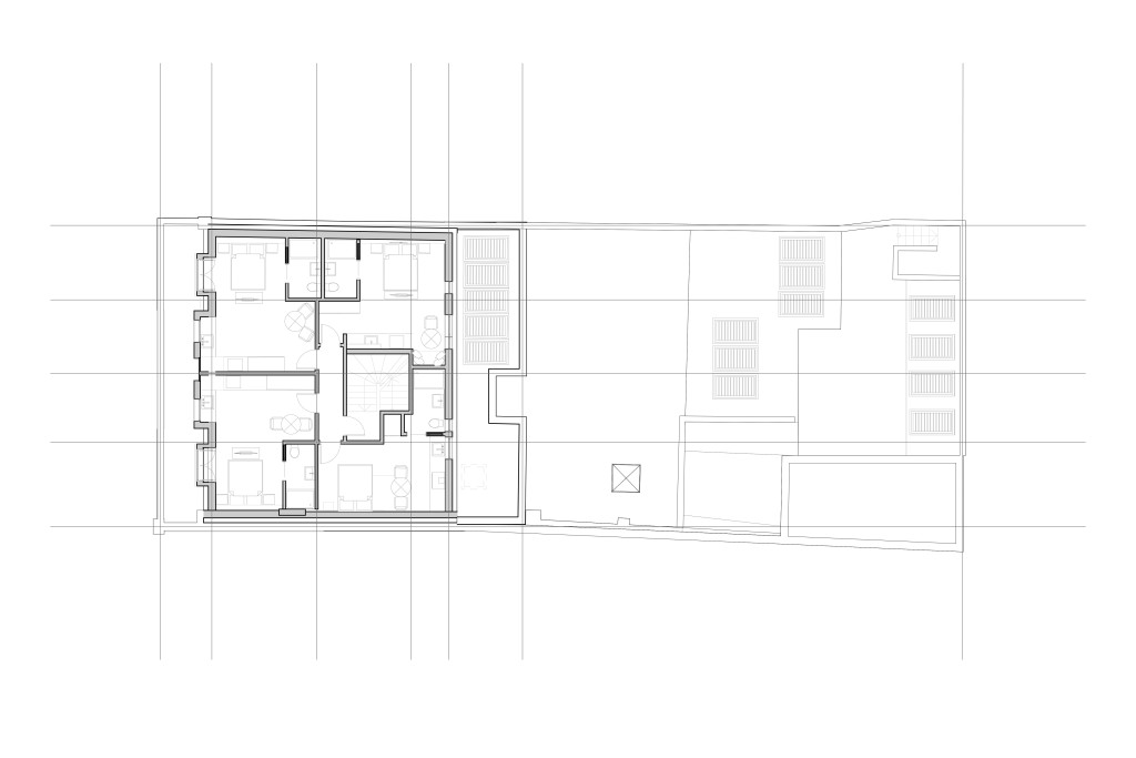 Architectural blueprint of the proposed second-floor plan for a residential project in Greenwich, featuring a detailed arrangement of short-let apartments, communal spaces, and precise room configurations for planning and development purposes.