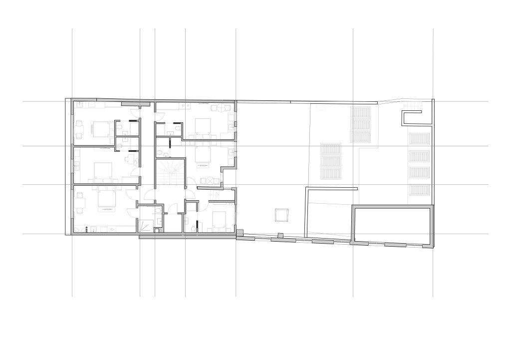 Detailed proposed first-floor architectural plan for a Greenwich development, displaying an intricate layout of residential units with individual rooms, furniture placement, and amenities designed for modern short-term living.