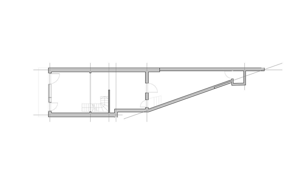 Grey and black scale floor plan drawings of the existing traingular ground floor commercial unit with a two door access from the street