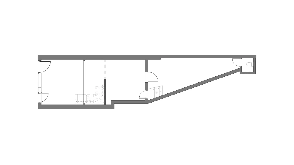 Grey and black scale floor plan drawings of the existing traingular ground floor commercial unit with a two door access from the street