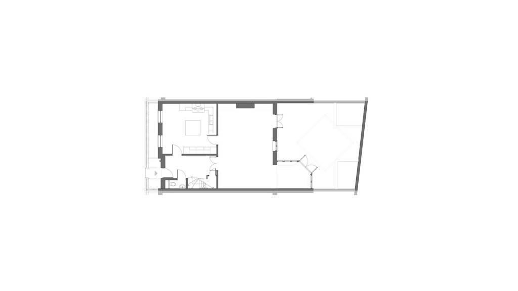 Architectural floor plan of an existing ground floor layout in a conservation area in Greenwich, showcasing the spatial arrangement of rooms prior to a proposed extension. The plan highlights the original layout of the property, including the positioning of living areas, kitchen, and access points. This image is crucial for understanding the before and after impact of the ground floor extension on the functionality and flow of the space, particularly within the context of preserving the historical character of the surrounding area.