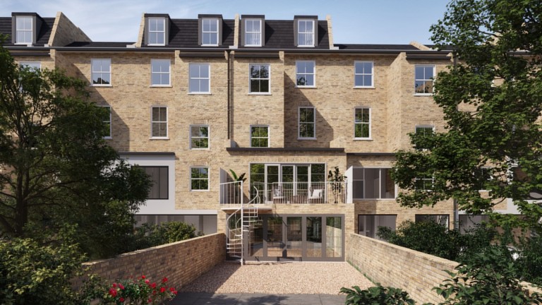 Modern double-storey rear extension on a renovated Victorian house with mansard roof, featuring expansive glass doors, a balcony with spiral staircase, and lush garden surroundings, illustrating a blend of classic architecture with contemporary design in a conservatin area.