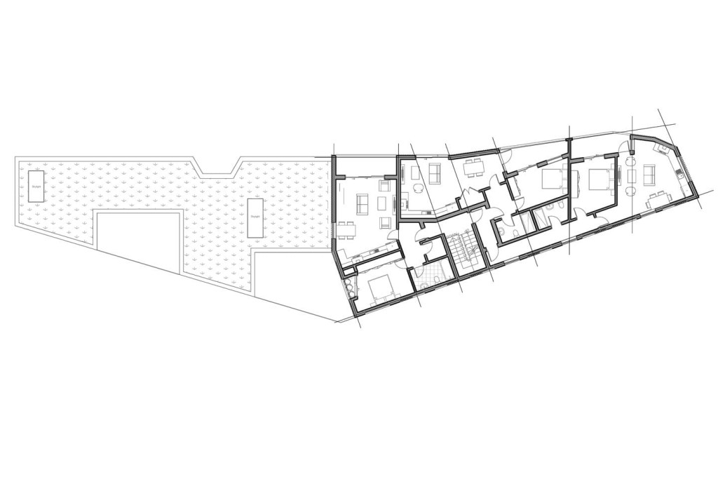 Grey scaled architectural plans for the proposed first floor of the development which on the left hand side depicts the green roof and skylights from the ground floor units and on the right hand side proposed one bedroom apartment with a large balcony fronting the property as well as a small balcony directly leading from the bedroom, another one bedroom flat with a private balcony at the front of the property and a final corner one bedroom flat with a very large private balcony.  