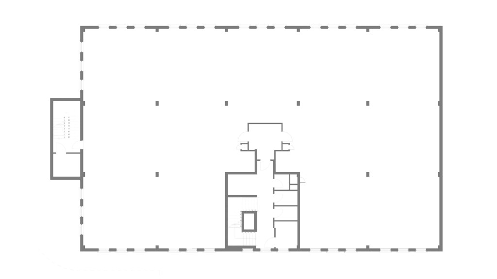 The existing first-floor plan features a large, open space with minimal internal walls, highlighting the structure's potential for adaptive reuse. This blank slate allows for creative reconfiguration into stylish residential flats, capitalising on the ample natural light from the surrounding windows.